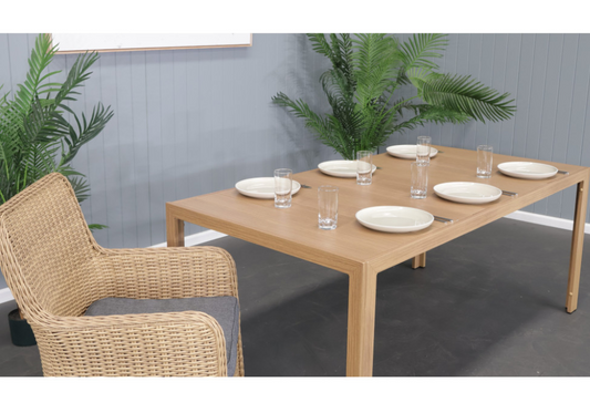 CAPELL 1800 7-PIECE OUTDOOR DINING SUITE TEAK LOOK WICKER ON ALUMINIUM FRAME/CHARCOAL CUSHIONS
